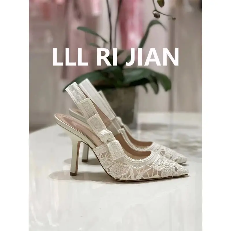 Elegant white stiletto heels side view